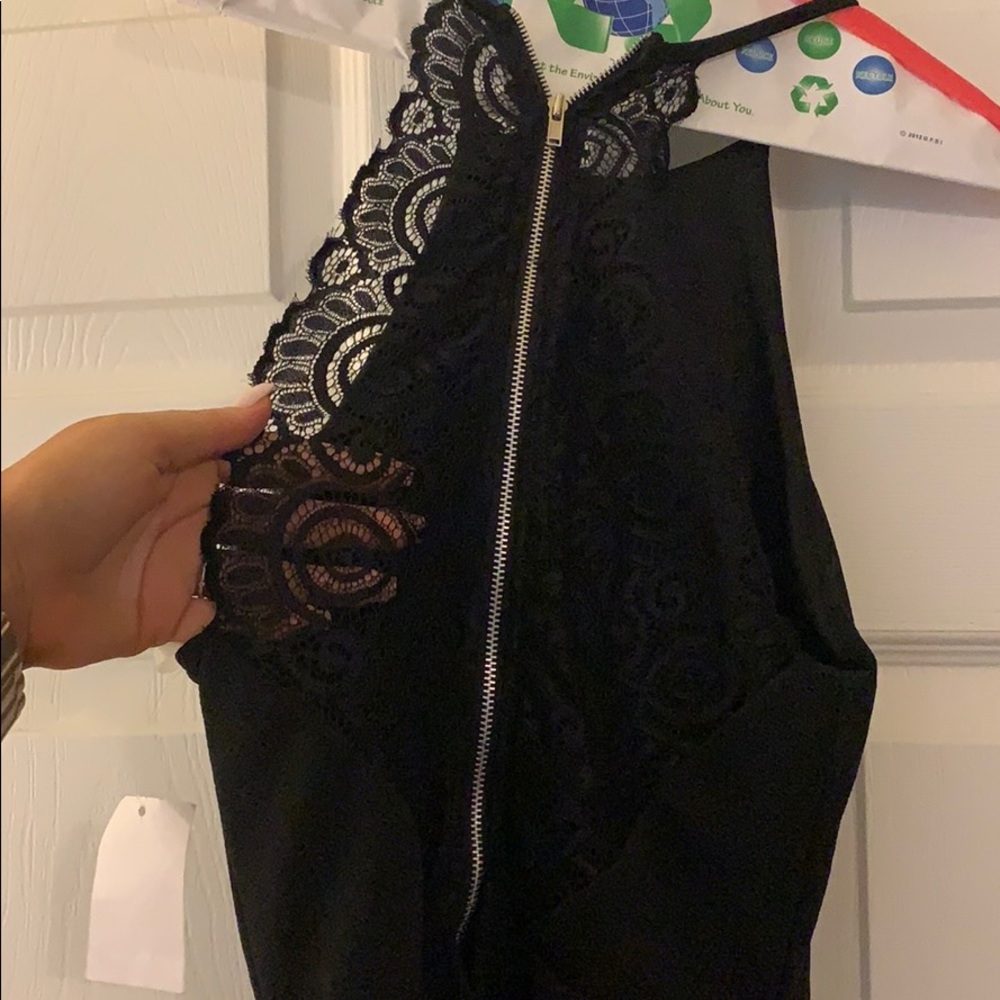 Black peplum dress with lace back detail